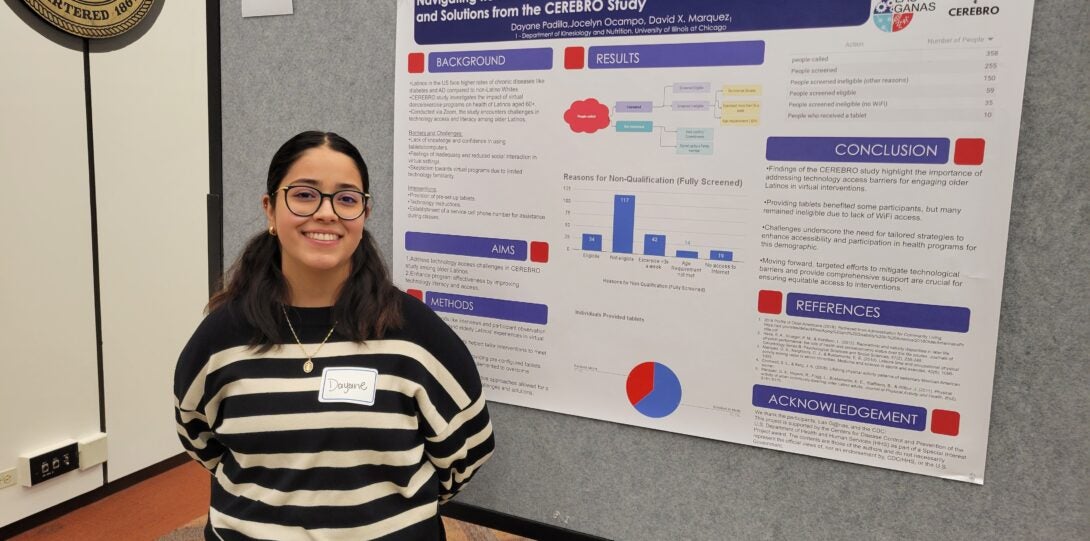 woman standing in front of poster