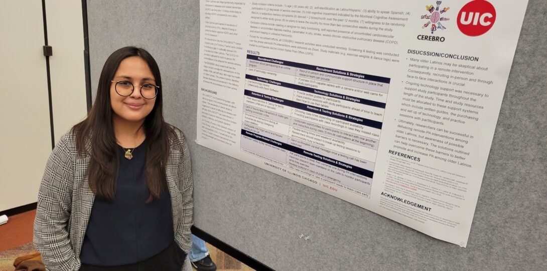 Woman standing in front of poster