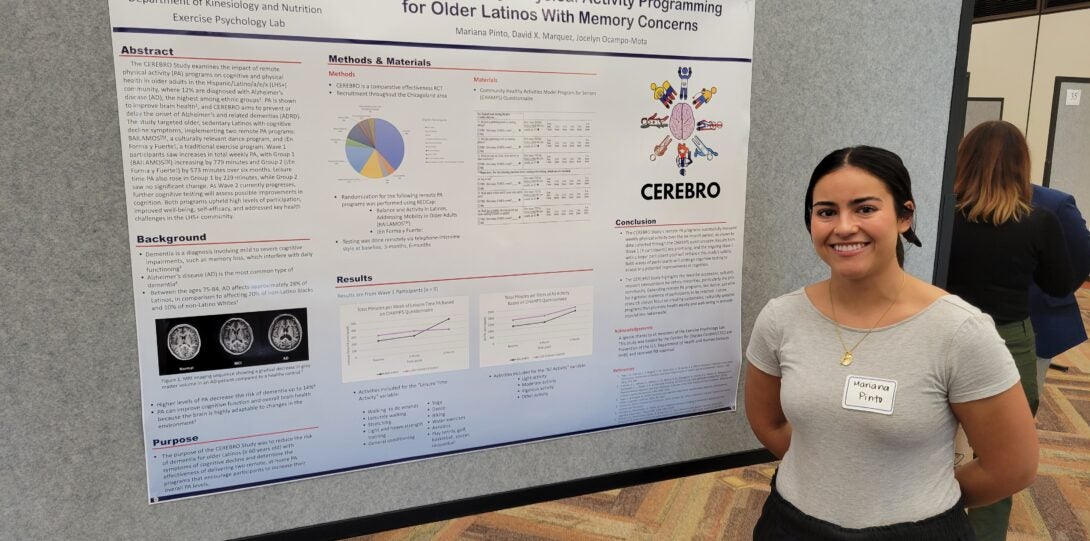 Woman standing in front of poster